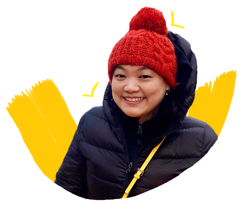 A Korean woman wearing a red beanie and a black parka.