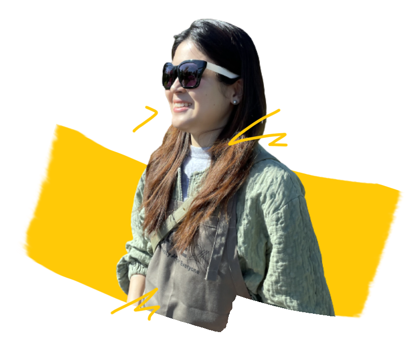 A Korean woman wearing sunglasses with rolled up sleeves