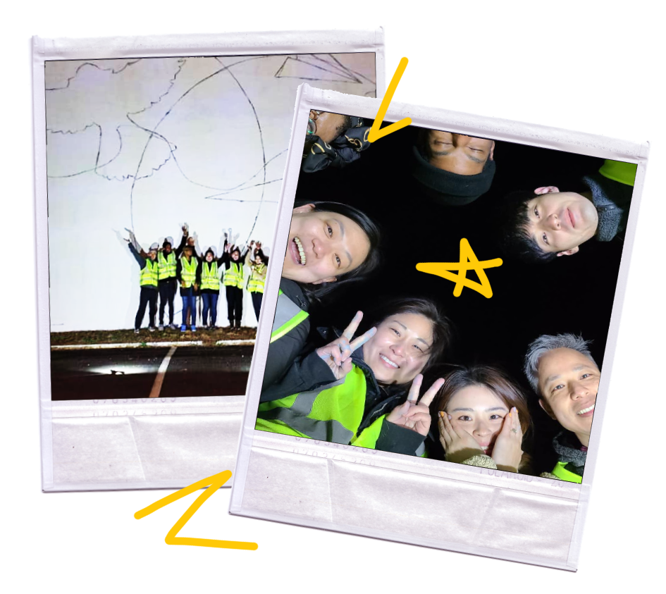 Polaroids of volunteers huddled around a giant mural wall at night, smiling brightly